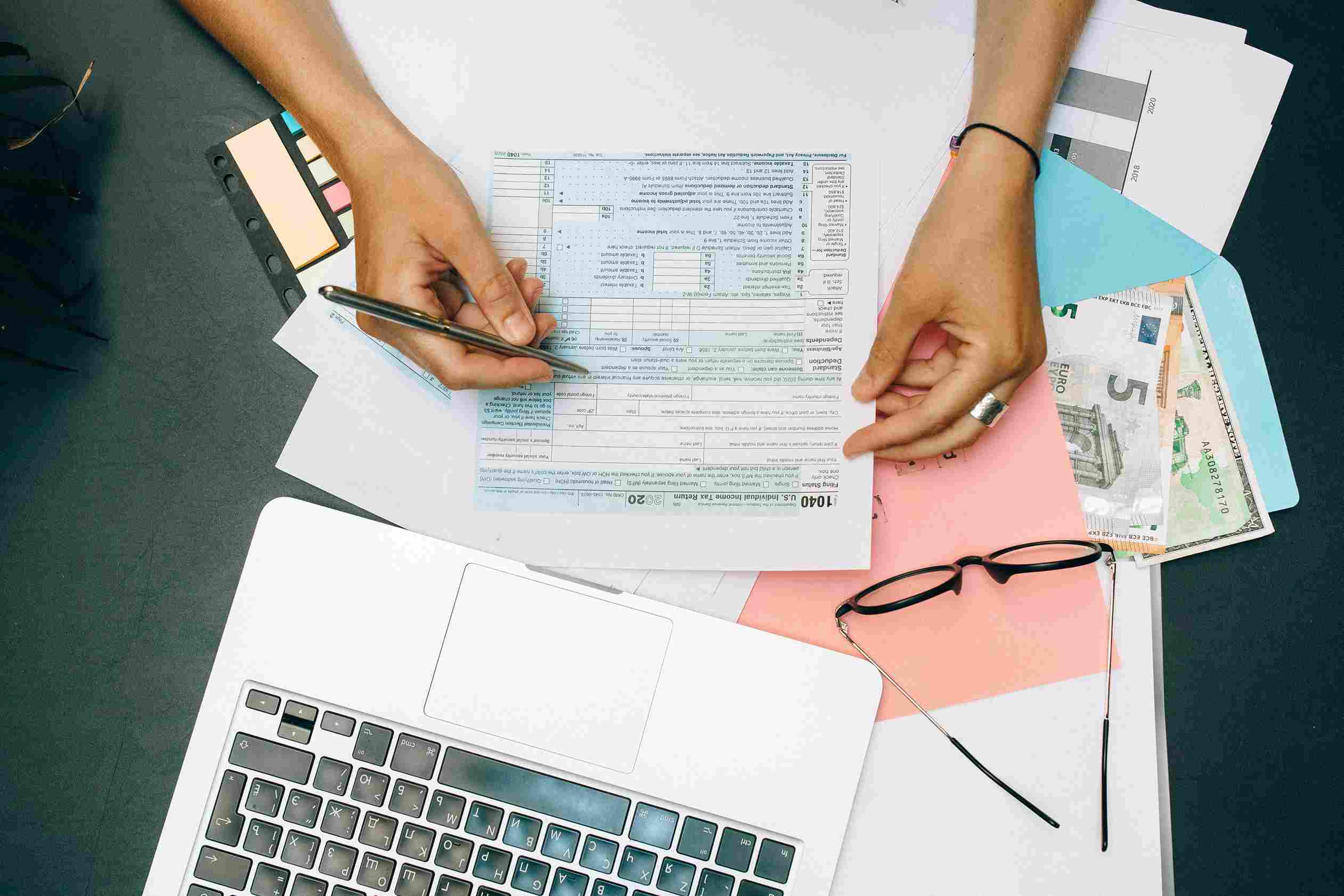 Accountant reviewing documents and tasks to determine which accounting tasks can be automated and what still needs human review
